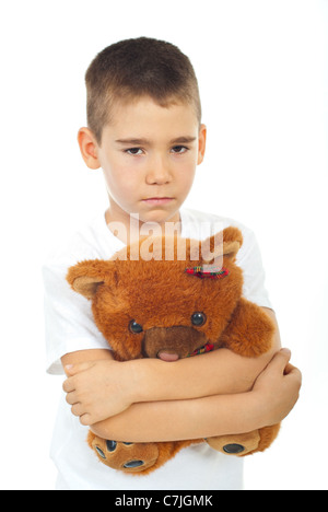 Sad kid boy hugging teddy bear and looking you isolated on white ...