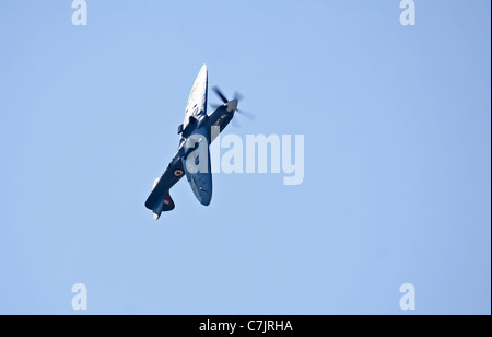 The Spitfire PS915 Mk XIX, part of the RAF Battle of Britain Memorial Flight (BBMF), was displayed at the Royal International Air Tattoo in Fairford on July 16, 2006. The aircraft is a historic fighter known for its role in WWII. Stock Photo