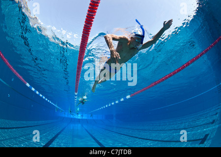 Swimmers training in an open air Olympic swimming pool (France). Underwater view. Stock Photo