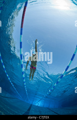 A male swimmer training in an open air Olympic swimming pool (France). Underwater view. Stock Photo