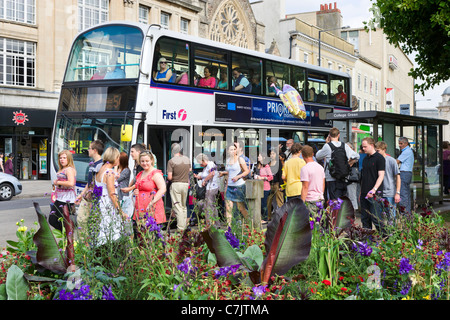 Crowded bus stop on College Green in the city centre, Bristol, Avon, UK Stock Photo