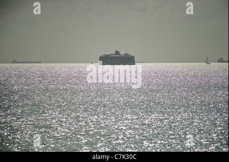 Horse Sand Victorian Sea Fort in the Solent with passing shipping in the English Channel in the distance. Stock Photo