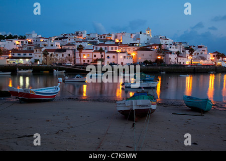 Portugal, Algarve, Ferragudo, Village & Boats at Dusk Stock Photo