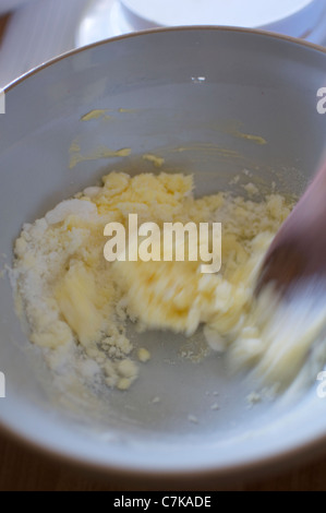Butter and sugar being creamed for baking. Stock Photo