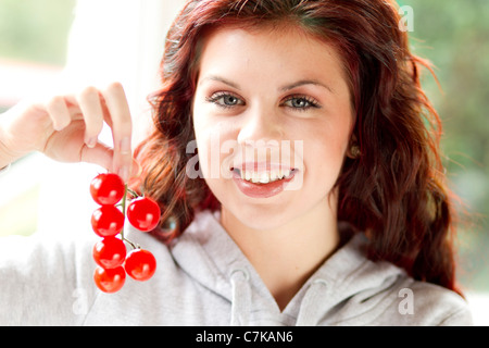 Woman holding cherry tomatoes Stock Photo