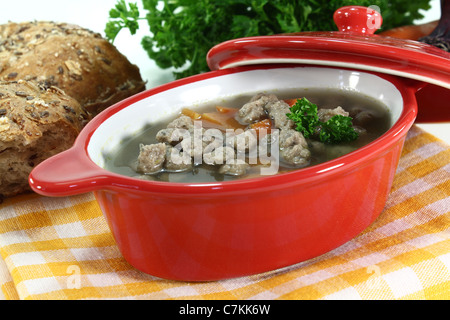 Liver noodles soup with vegetables and parsley in a soup tureen Stock Photo