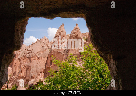 View of fairy chimneys and rock formations from inside one of the caves, Zelve open air museum, Cappadocia, Turkey Stock Photo
