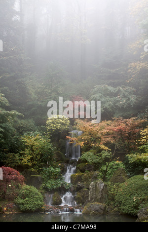 Waterfall at Japanese Garden in Fall Foggy Morning Stock Photo