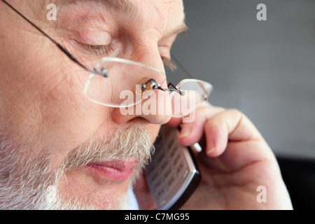 old man at phone Stock Photo