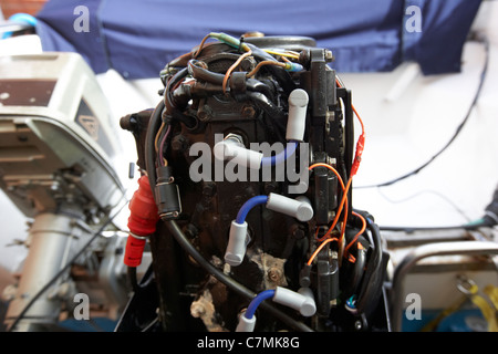 rear of an old 2 stroke outboard motorboat engine Stock Photo