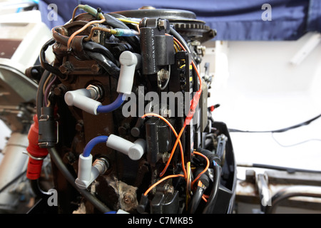 rear of an old 2 stroke outboard motorboat engine Stock Photo