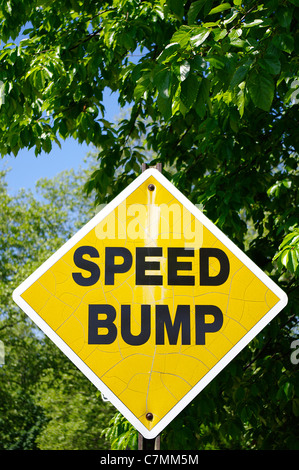Yellow Speed Bump sign on a sunny day Stock Photo