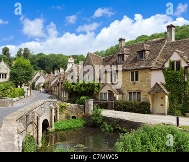 Castle Combe. Bridge over the brook and view down the main street in the picturesque village of Castle Combe, Wiltshire, England, UK Stock Photo