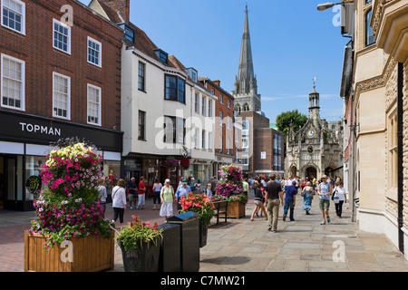Shops on East Street in the city centre looking towards the cathedral, Chichester, West Sussex, England, UK Stock Photo