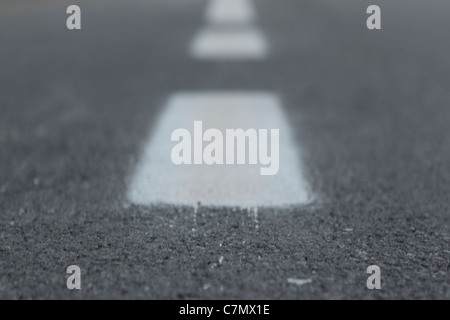 white stripes in the middle of the road Stock Photo