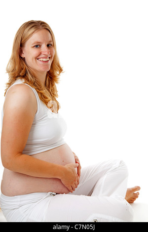 Studio portrait of pregnant woman over white background Stock Photo