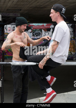 Grafitti-land on the South Bank, London- tatooed skateboarders Stock Photo