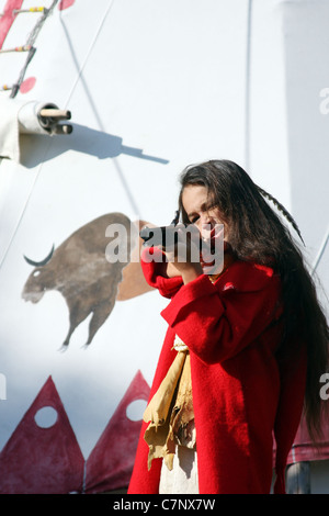 A young Native American Indian boy holding a gun Stock Photo