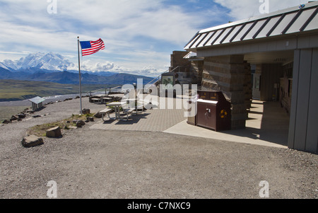 Eielson Visitor Center with an American Flag and Denali (Mt. McKinley) in the background, Denali National Park, AK, USA. Stock Photo