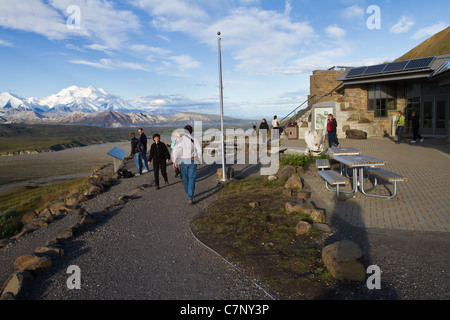 Tourists enjoy a sunny morning at Eielson Visitor Center with Denali (Mt. McKinley) in the background, Denali National Park, AK. Stock Photo