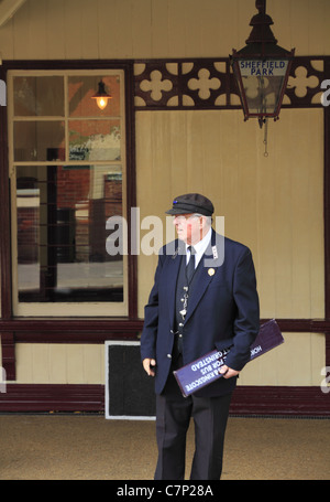 The station master waits on the platform at The Bluebell Line Steam Railway, Sheffield park, West Sussex, England. Stock Photo