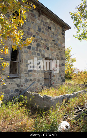 Old abandoned homestead in the middle of a field, Saskatchewan Canada. Stock Photo