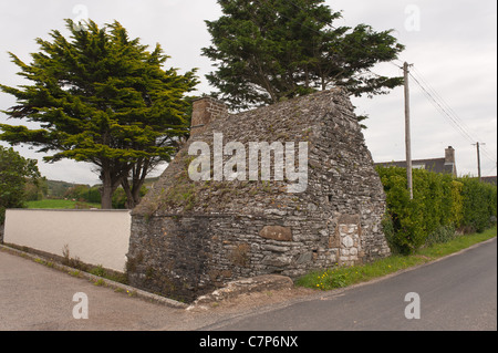 Old Normandy farm house made from local rocks shale ans schist stone with the heavy and unusual roof made from rocks Stock Photo
