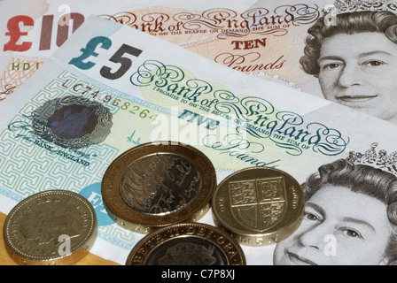 English pounds notes with coins Stock Photo