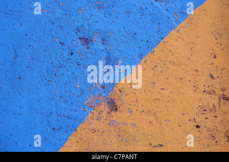 blue and yellow painted and grunge concrete background Stock Photo