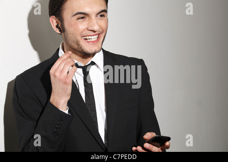 Businessman talking on headset Stock Photo