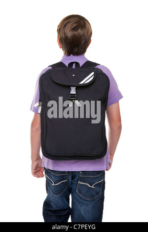 Photo of an 11 year old school boy carrying his school rucksack bag, isolated on a white background. Stock Photo