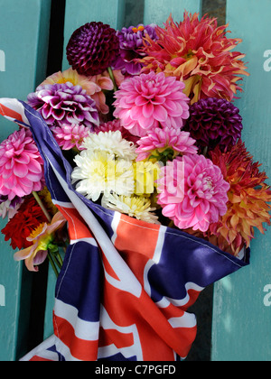 A bunch of dahlia flowers in a union jack flag Stock Photo