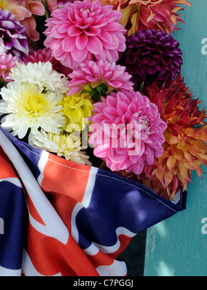 A bunch of dahlia flowers in a union jack flag Stock Photo