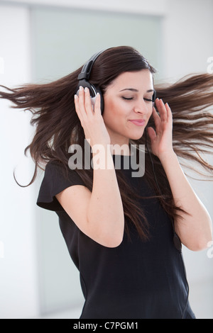 Woman dancing in headphones Stock Photo