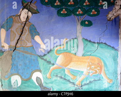 Mural painting of a Mongol with a chained tiger symbolising the supremacy of the Mongol yellow hat buddhists over the Tibetan Stock Photo