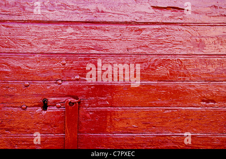 painted old doors fragment red background Stock Photo