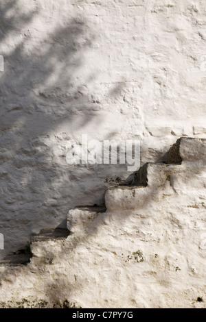 Whitewashed stonework steps outdoors. Stock Photo