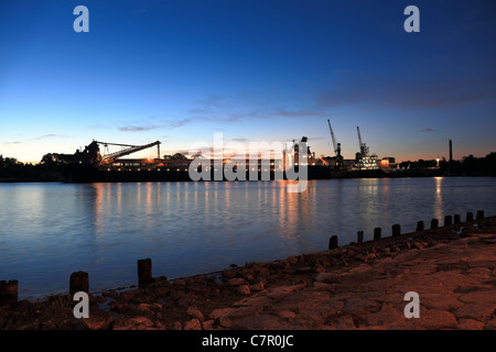Sulfur loading on a ship in port of Gdansk, Poland. Stock Photo