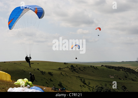parascenders taking off from Devils Dyke on a summers day Stock Photo