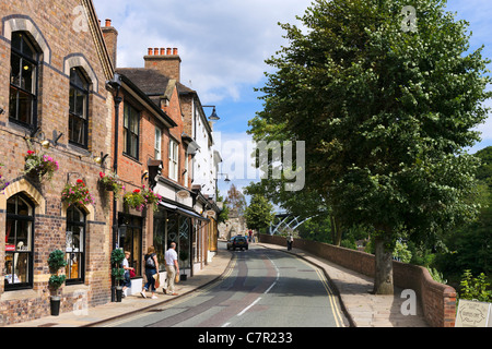 Shops along The Wharfage with the iron bridge in the distance, Ironbridge, Shropshire, England, UK Stock Photo