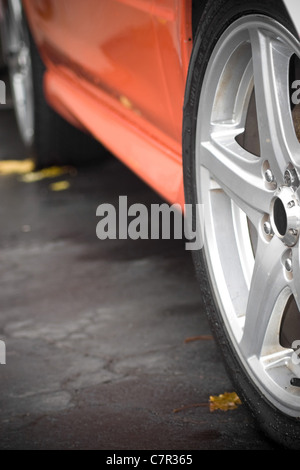 A closeup of the custom rims on a modern sports car with plenty of copyspace. Shallow depth of field. Stock Photo