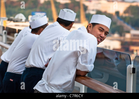Crew from Asian countries working on British Cruise ship. 2011. Stock Photo