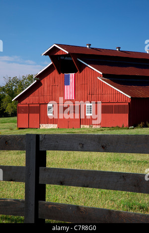 Red barn with American flag near Franklin Tennessee Stock Photo