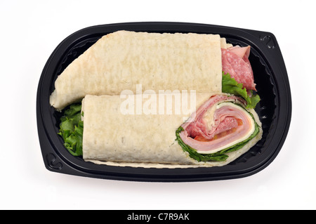 Italian sandwich  wrap cut in half on black plate on white background.  USA. Stock Photo