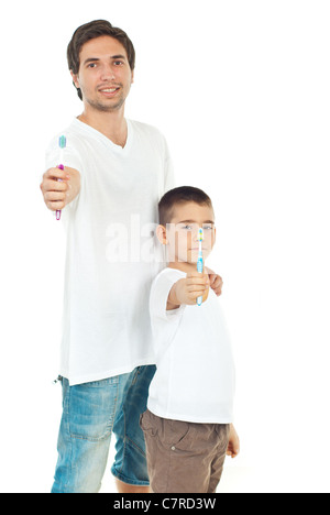 Father and son giving toothbrushes isolated on white background Stock Photo