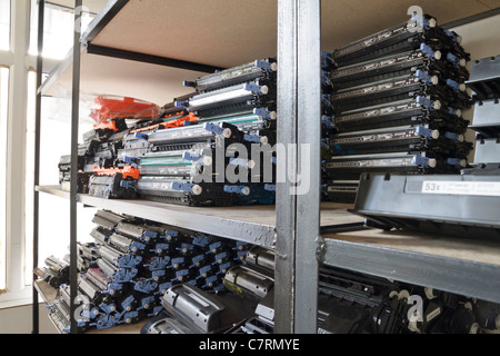 Used toner cartridges on a black residual waste bin (photomontage ...