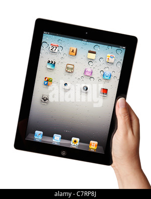 Hand holding iPad showing applications menu screen Stock Photo