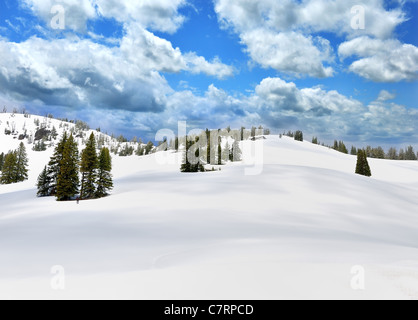 Snow In A High Mountains And A Blue Sky Stock Photo