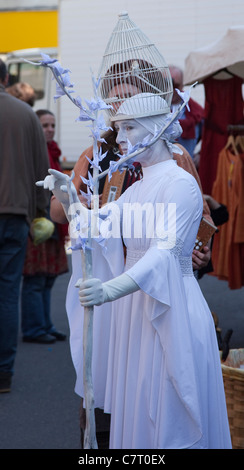 A woman in a white statue like costume in Esperaza, France Stock Photo