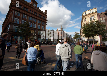 shoppers at Bank Buildings at Castle Junction and Royal Avenue shopping area, Belfast, Northern Ireland, UK. Stock Photo